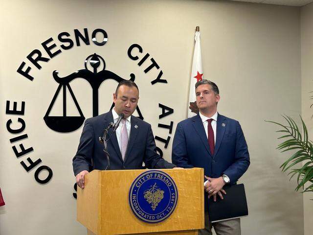 Fresno City Attorney Andrew Janz, left, and District 4 City Councilmember Tyler Maxwell, right, announced the city’s first wage theft prosecution at City Hall on Monday, May 12, 2025.